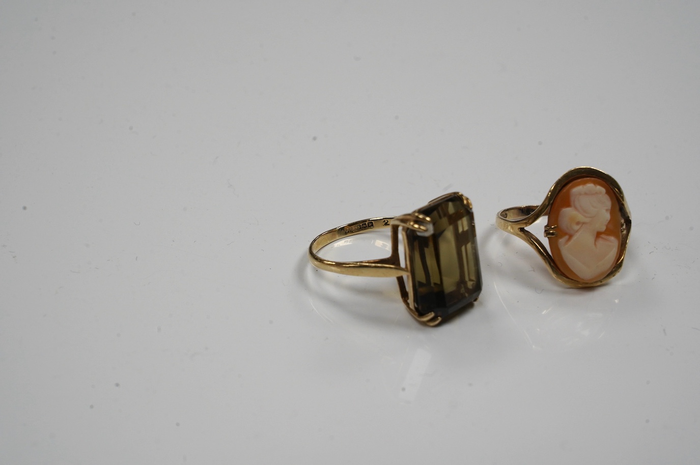 Two 9ct gold and gem set rings to include citrine and cameo shell, gross weight 8.6 grams. Condition - fair to good